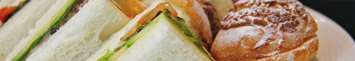 Eating Italian Pizza Sandwich at UNCLE TONY'S PIZZA restaurant in South Burlington, VT.